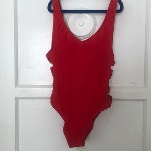 Woman’s red one piece bathing suit